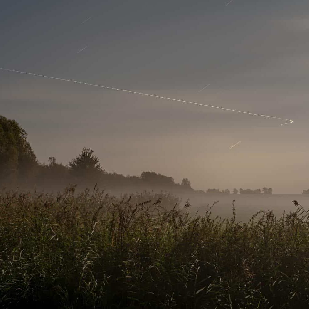 Steve Giovinco- Untitled (Netherlands, #6700), 50x38", Ed. 1/5
Almere, Flevoland. Long-exposure photograph, 60+ minutes. Fog rises in the field, with plane causing line in the sky.